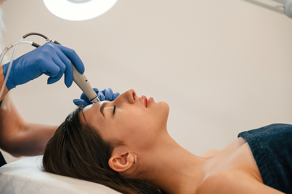 Procedure on the face. Getting photo rejuvenation at cosmetology clinic. Women in beauty salon Procedure on the face. Getting photo rejuvenation at cosmetology clinic. Women in beauty salon