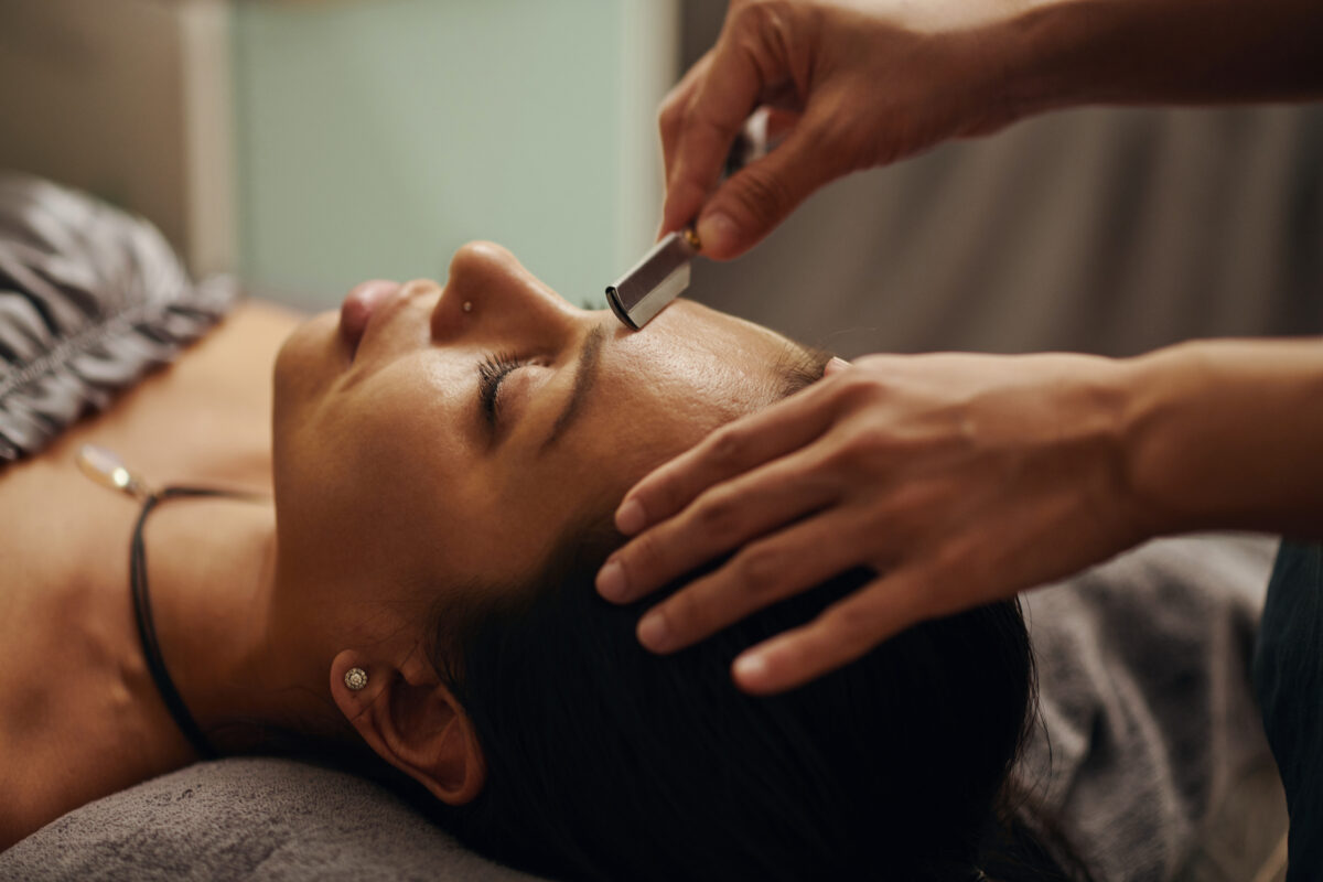 Dermaplane facial removing dead skin and peach fuzz at Belle Âme Med Spa in Oklahoma City