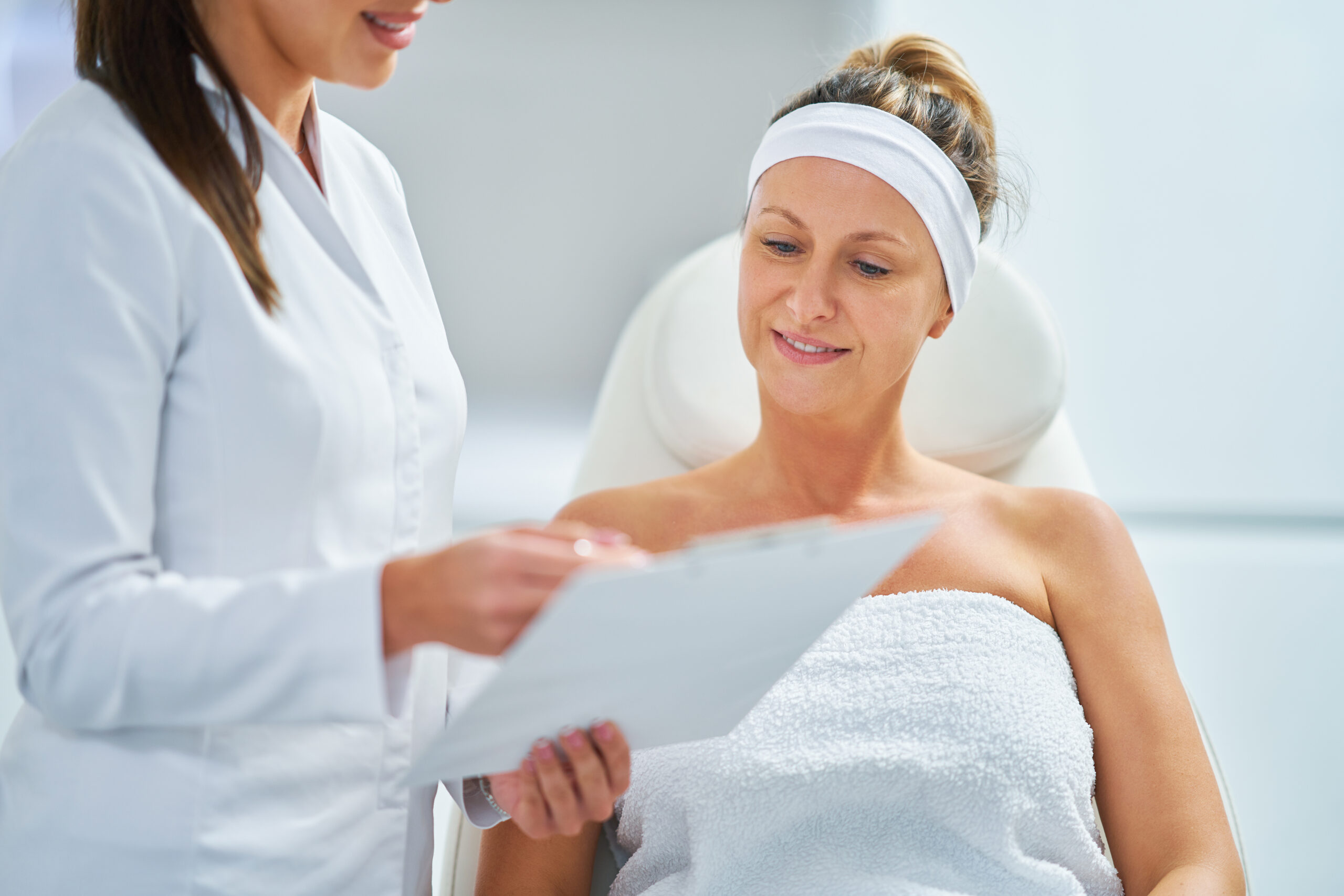 Hormone replacement therapy patient reviewing treatment recommendations with provider